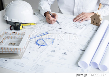 Construction engineering or architect hands 61560257