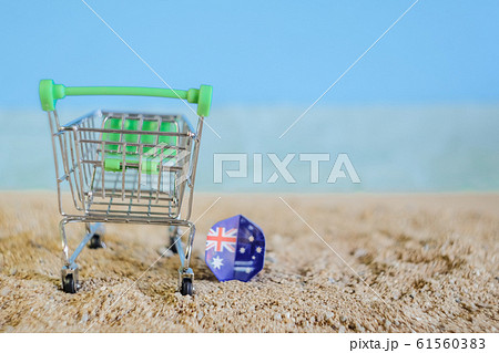 Australia flag drop on tropical sand beach. Australia flag drop on tropical sand beach. 61560383