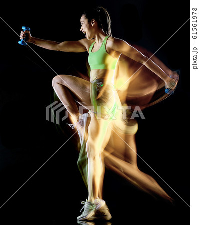 woman exercising fitness exercises isolated black background lightpainting effect 61561978