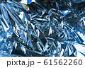 Abstract crumpled foil background. Grunge photo 61562260