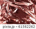 Abstract crumpled foil background. Grunge photo 61562262