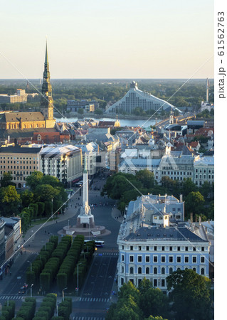 Old town views to St. Peter's Church and the Freedom Monument in Riga. Old town views to St. Peter's Church and the Freedom Monument in Riga. 61562763