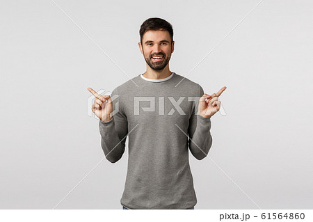 Time make your choice. Cheerful happy, smiling bearded male employee, give advice what buy, shopping sites, pointing sideways, showing left and right promo, suggest choices, white background Time make your choice. Cheerful happy, smiling bearded male employee, give advice what buy, shopping sites, pointing sideways, showing left and right promo, suggest choices, white background 61564860