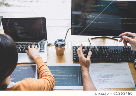 Programmers cooperating at Developing programming Programmers cooperating at Developing programming 61565460