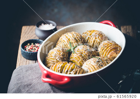 Baked hasselback potatoes 61565920