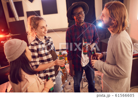 Group of Young People Relaxing in Music Studio Group of Young People Relaxing in Music Studio 61566605