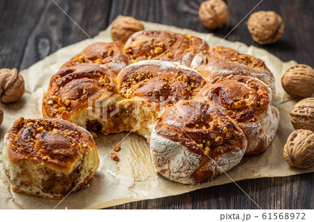 Homemade cinnamon and walnut swirl buns. 61568972