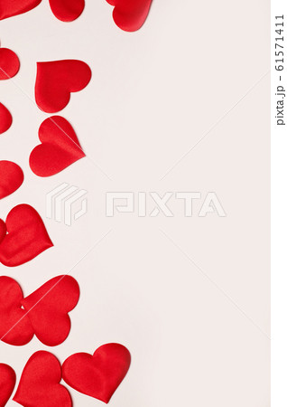 Valentine's Day. Many red hearts on a white background.Texture. Free space on the right. Valentine's Day. Many red hearts on a white background.Texture. Free space on the right. 61571411