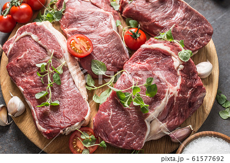 Beef ribe eye steaks with rosemary oregano and Beef ribe eye steaks with rosemary oregano and 61577692