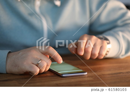 Man checking messages 61580103