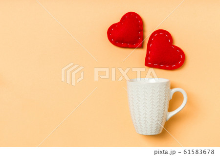 Top view of red textile hearts splashing out of a 61583678