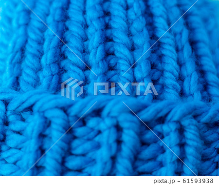 Knitted texture. A sample of knitting from wool. 61593938