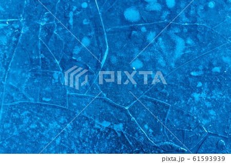 Blue cracked surface of the ice surface, winter 61593939