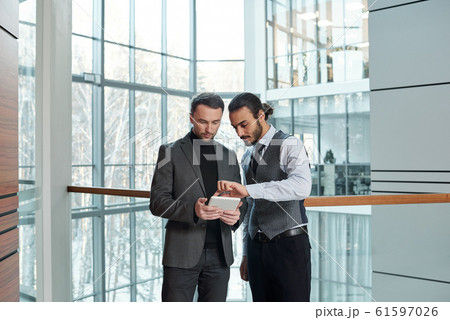 One of young confident analysts making presentation of online data 61597026