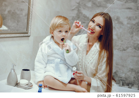 Mother with little son in a bathroom Mother with little son in a bathroom 61597925