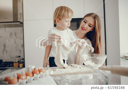 Family cook the dough for cookies 61598166