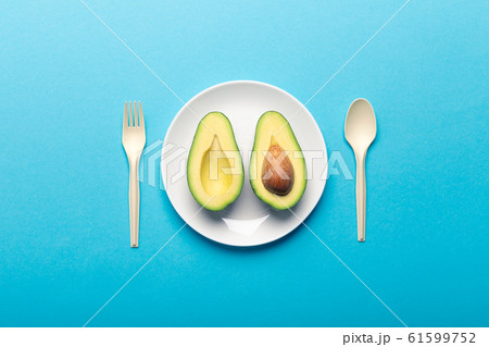 Eating avocado and getting bioplastic disposable tableware 61599752
