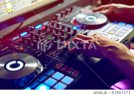 Dj mixes the track in the nightclub at a party 61601571