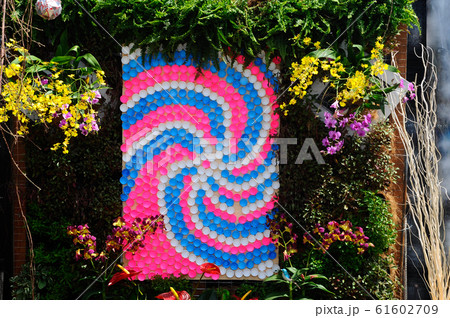 Small pocket garden made from mix of recycle material and mix of flower at Floria Garden, Putrajaya, Malaysia. Small pocket garden made from mix of recycle material and mix of flower at Floria Garden, Putrajaya, Malaysia. 61602709