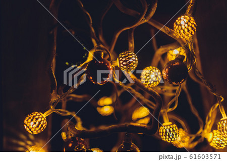 Blur Christmas lights on dark golden background. Defocused Christmas garland, copyspace. Blur Christmas lights on dark golden background. Defocused Christmas garland, copyspace. 61603571