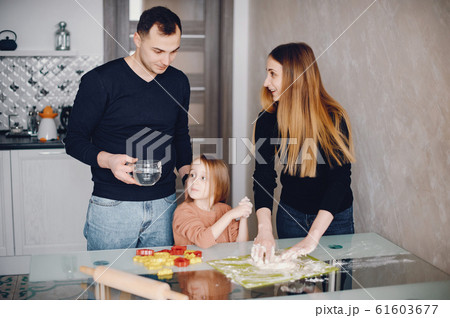 Family cook the dough for cookies 61603677