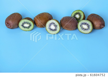 Ripe kiwi on a blue background 61604752