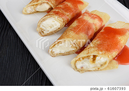 Pancakes stuffed with cream 61607393