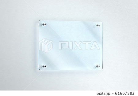 Blank glass nameplate mounted on the wall mockup, clipping path 61607582