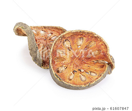 Dry Bael fruit - Slices of dry Bael fruit isolated on white  background 61607847