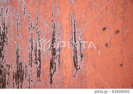 Rusty metal surface with peeled paint and etched numbers. Abstract background texture. 61608092