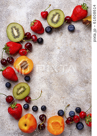 Fruits and berries summer background Fruits and berries summer background 61608614