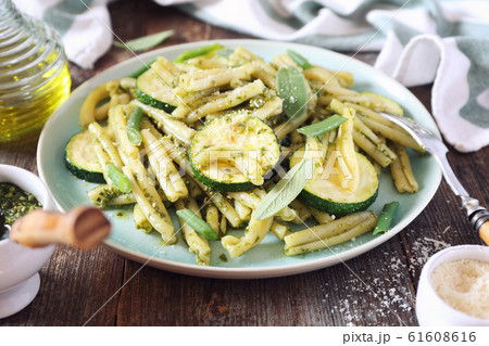 Italian penne pasta with roasted zucchini, pesto sauce and green beans Italian penne pasta with roasted zucchini, pesto sauce and green beans 61608616