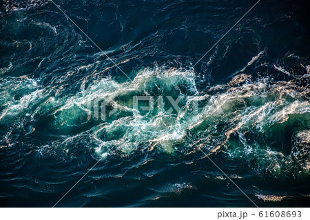 Waves of water of the river and the sea meet each 61608693