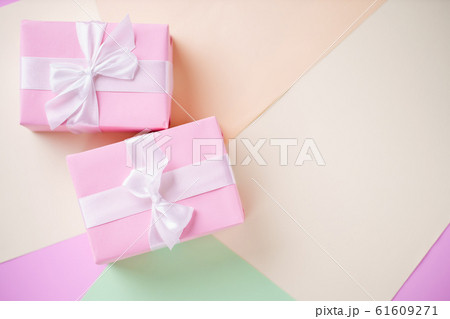 Creative holiday presents on multicolored backdrop 61609271