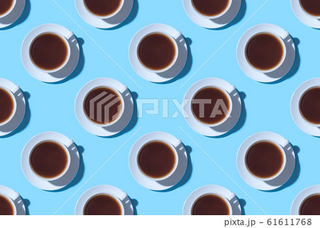 Pattern of cups of black coffee or tea on a blue background. Pattern of cups of black coffee or tea on a blue background. 61611768