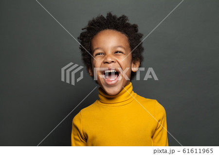 Laughing kid on gray background 61611965
