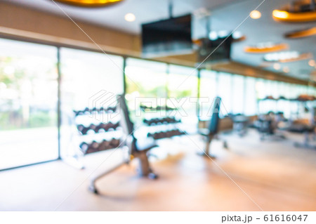 Abstract blur gym room interior with fitness equipment 61616047
