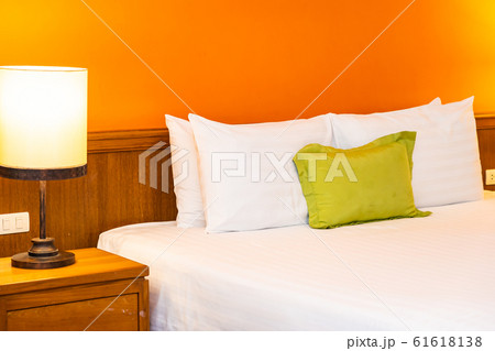 White comfortable pillow on bed decoration interior White comfortable pillow on bed decoration interior 61618138