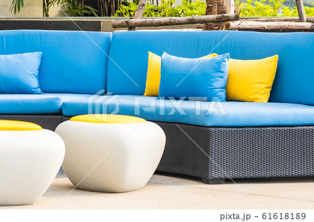 Outdoor patio in the garden with sofa chair and pillow decoration 61618189