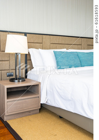 White comfortable pillow on bed decoration interior White comfortable pillow on bed decoration interior 61618593