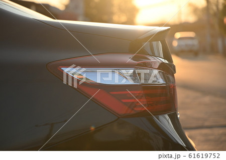 closeup tail light of black modern car in the morning scene closeup tail light of black modern car in the morning scene 61619752