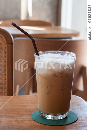 Iced coffee in coffee shop on wooden table 61621888