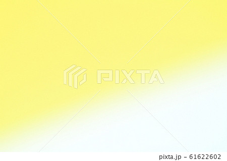 黄色系パステルカラーの抽象的背景素材ーゆるやかなラインの写真素材