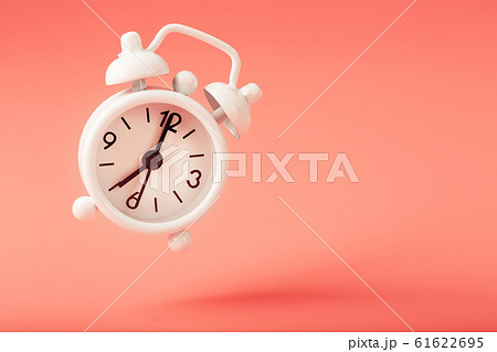 White alarm clock in levitation with shadow 61622695