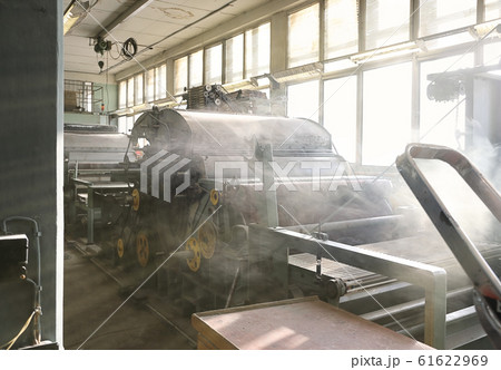Old weaving looms in an abandoned textile factory Old weaving looms in an abandoned textile factory 61622969