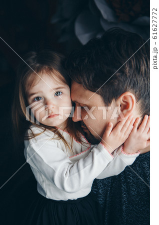 Dad holds the baby in his arms. The concept of educating the father of young children, Happy childhood, a friendly family. 61627772