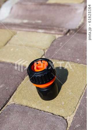 Connector for watering hose at the dacha. Close-up. Connector for watering hose at the dacha. Close-up. 61628164