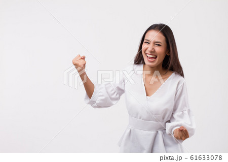 excited asian woman looking up 61633078