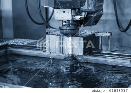 The  Wire EDM machine cutting the die parts. 61633557