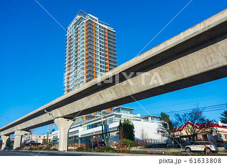 Skytrain lane in front of residential tower building 61633808